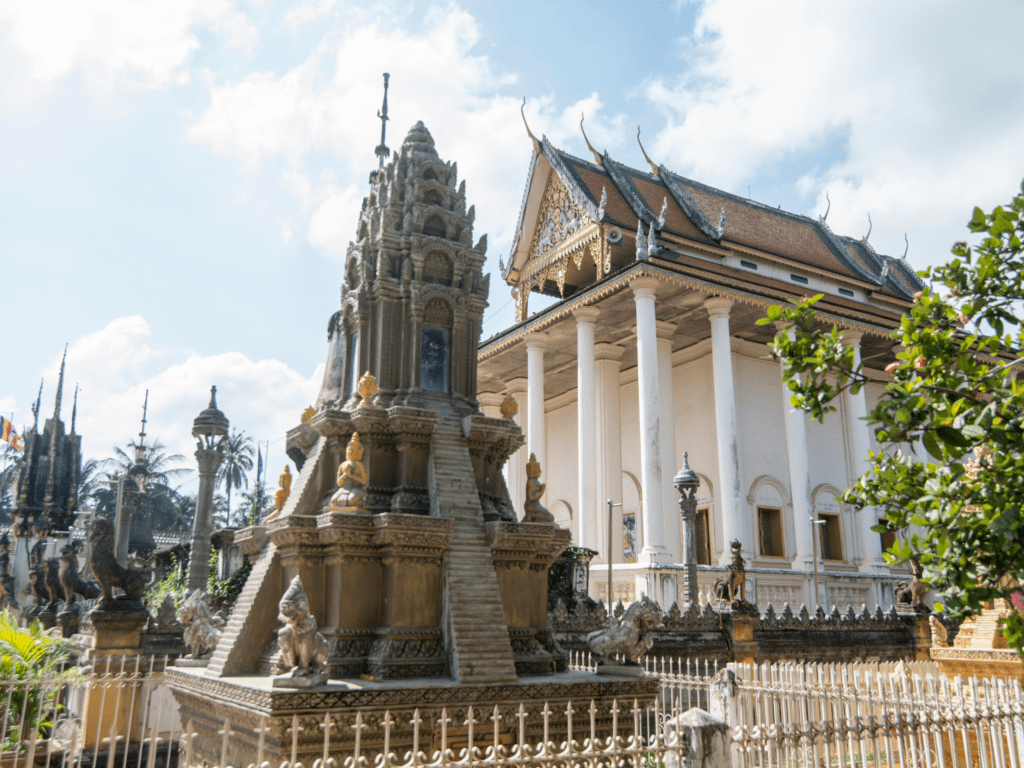 A historic Buddhist temple in Battambang, Cambodia, with intricate Khmer architecture, golden decorative details, and a serene courtyard. A significant cultural and religious landmark for travelers exploring Cambodia’s heritage sites.