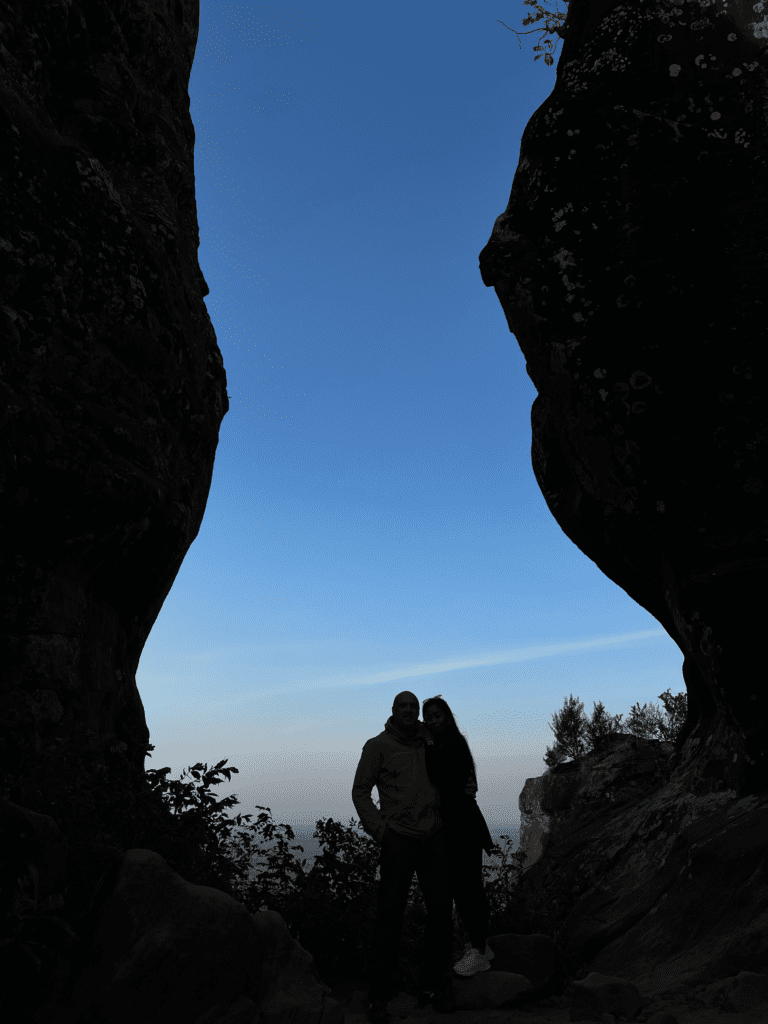 Hidden Thailand: Silhouetted couple framed by rock formations at Three Whale Rock, Unusual places in Thailand: A couple enjoying sunrise at Three Whale Rock, a hidden gem, Hidden gems in Thailand: Stunning natural rock formations framing a quiet moment, Best secret spots in Thailand: A breathtaking silhouette captured at a remote scenic spot, Off-the-beaten-path Thailand: Exploring hidden caves and rock formations at sunrise