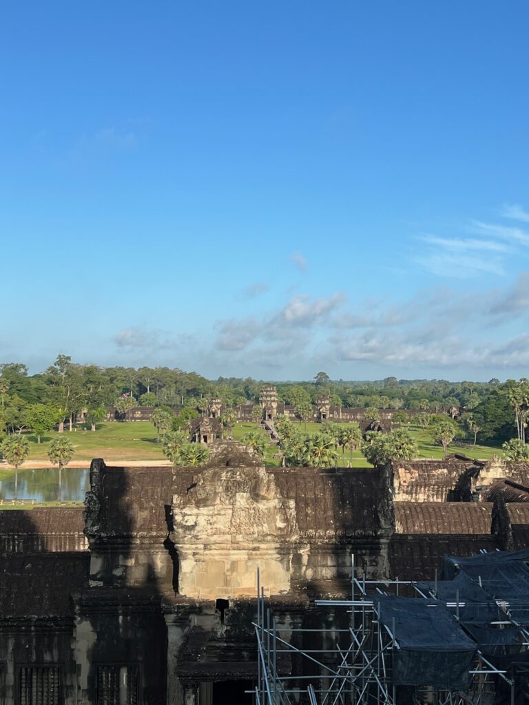 Aerial view of Angkor Wat’s temple complex in Siem Reap, Cambodia, showcasing the vast and lush surroundings of this UNESCO World Heritage Site.