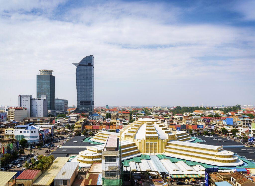 Central Market and Skyscrapers, Phnom Penh, Cambodia – Aerial view of Phnom Penh’s Central Market (Psar Thmei) with surrounding modern skyscrapers. A perfect spot for shopping and experiencing local Cambodian culture.