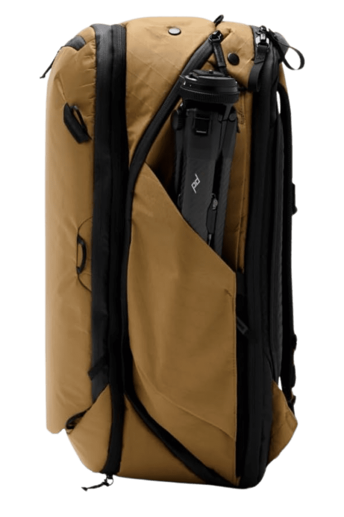Coyote-colored travel backpack with a built-in laptop sleeve, demonstrating its tech-friendly storage.