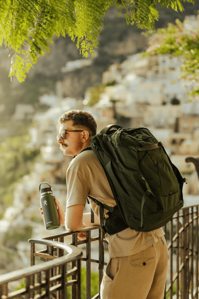 Traveler wearing the Osprey Farpoint 40 backpack, perfect for one-bag carry-on adventures in 2025