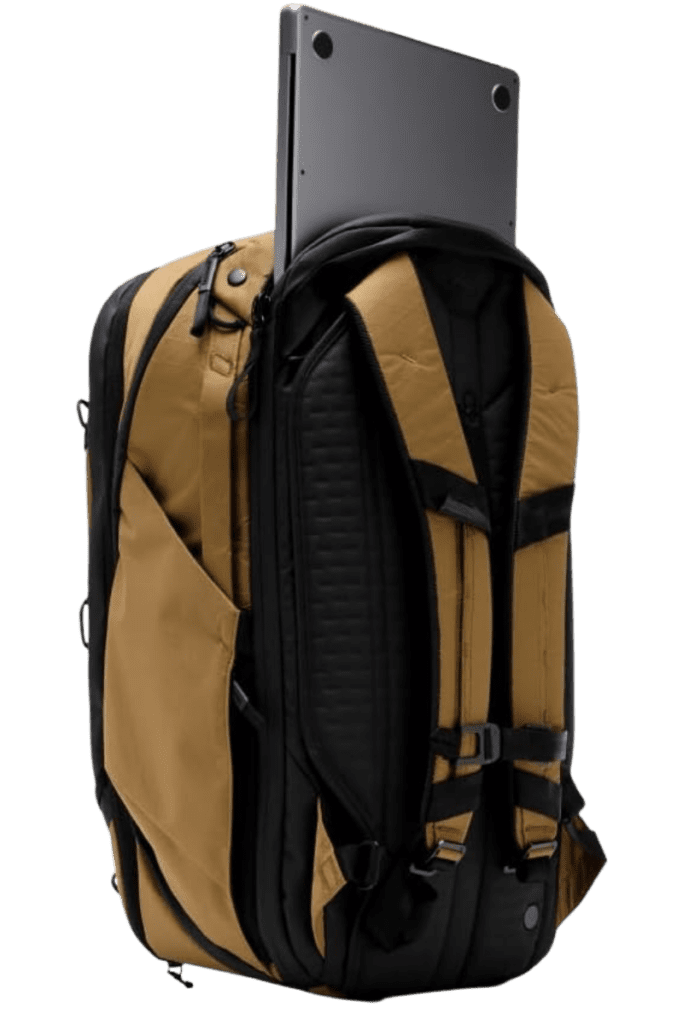 Coyote-colored travel backpack with a built-in laptop sleeve, demonstrating its tech-friendly storage.