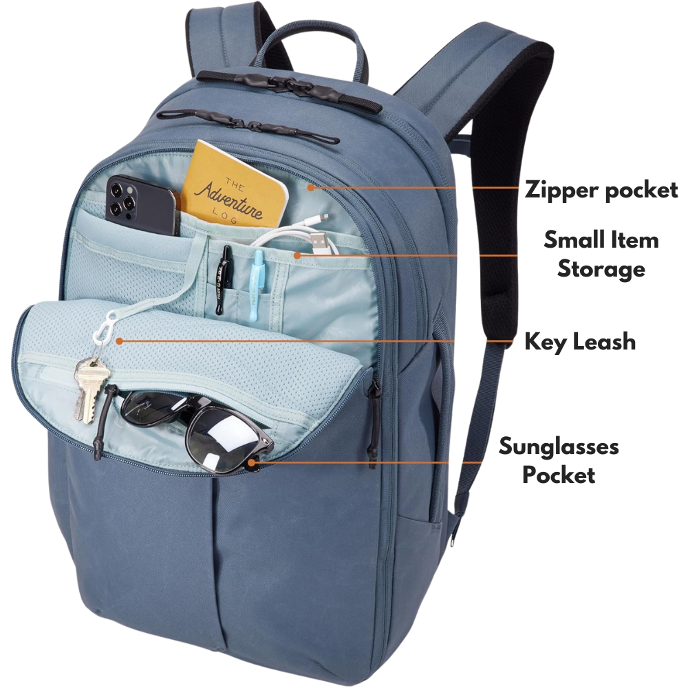 open.png – Close-up view of the Thule backpack’s front compartment, showing organized storage for small essentials like keys, phone, and pens.